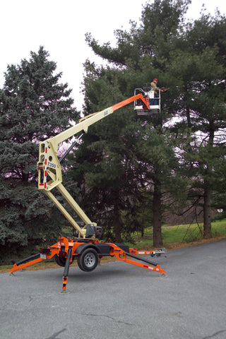A JLG T350 being operated to trim a tree.