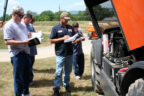 Image of a group of people conducting a service training at JLG Industries