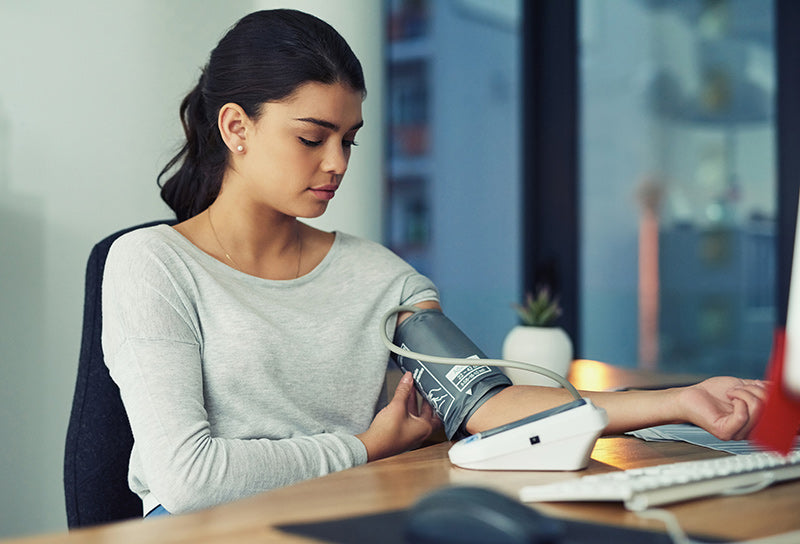 woman-taking-blood-pressure-at-work.jpg