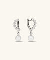 Remy Gemstone Pearl Charm Hoops featuring diamond-encrusted C-shaped silver earrings with detachable pearl charm, ideal for versatile styling.