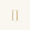 Bezel Lab Grown Diamond Tennis Earrings: A pair of 14k gold earrings featuring bezel-set, lab grown diamonds.