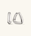 Patra Large Hoops: A pair of sleek silver earrings featuring a bold, circular design for a striking, modern look.