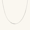 Serpentine Chain Necklace: A sleek silver chain, minimal yet impactful, perfect for any occasion.