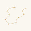 Dot Chain Anklet: A 14k gold anklet featuring small, delicate circles, ideal for stacking and daily wear. Perfect handcrafted piece for your jewelry collection.