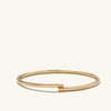 Bold Flexi Bangle in hollowed 14k gold, minimal design, flexible for everyday wear, shown on a white background.