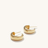 Dôme Hoops: A pair of gold earrings with a classic, bold design, ideal for stacking with daintier rings.