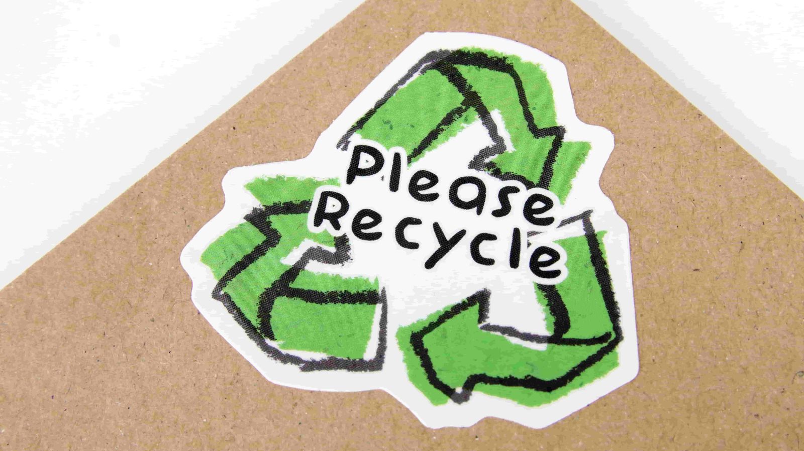 Cardboard box with please recycle logo ontop