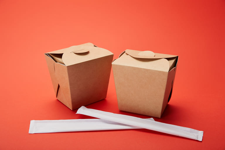 Paper takeaway Chinese food boxes with chopsticks