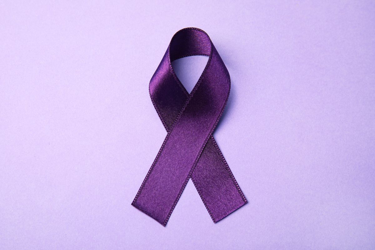 A purple ribbon for support and awareness for Crohn's disease.