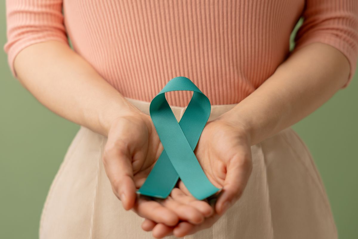 A woman holding scleroderma ribbon