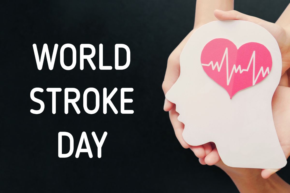 Hands holding picture of brain with world stroke day written on the black background.