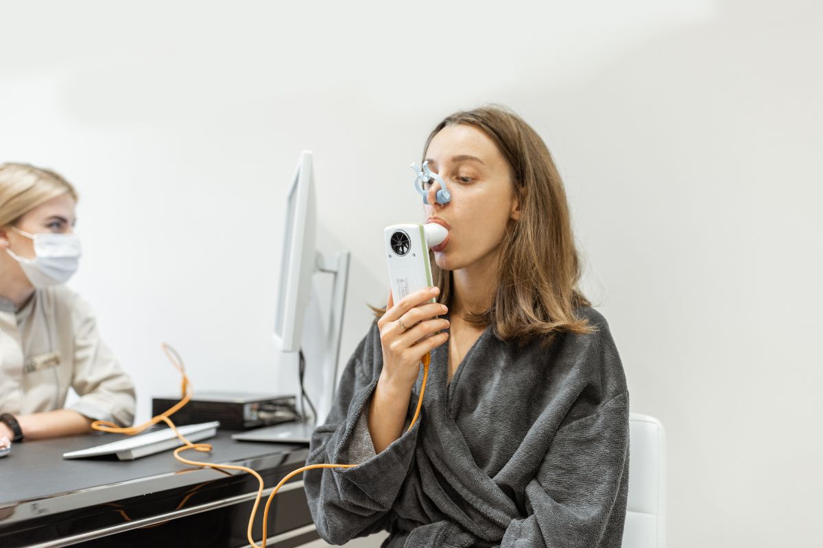 Young Woman during a Spirometry Test for Asthma.