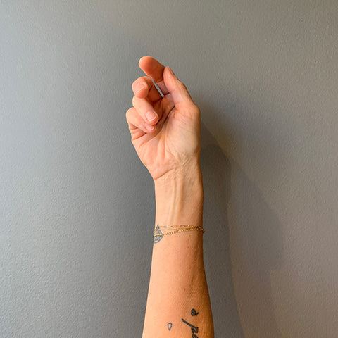 Bonded gold bracelets modeled on a woman's wrist