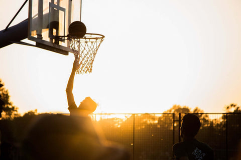 basketball player in the sunset
