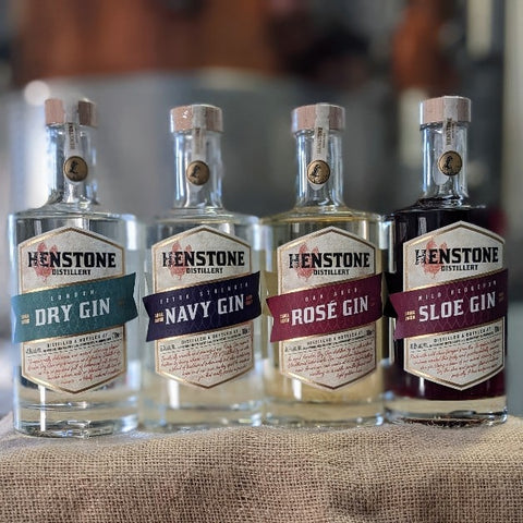 A picture of 4 henstone branded gin bottles