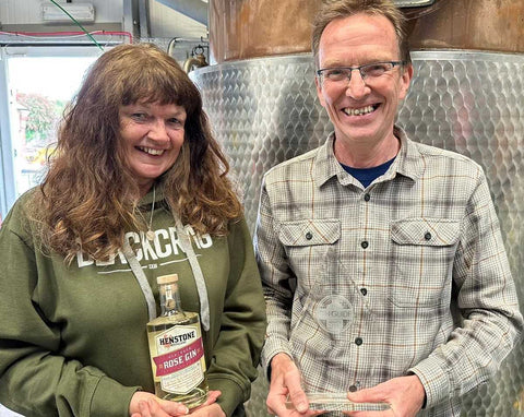 Alex and Chris with awards in front of our still, Hilda