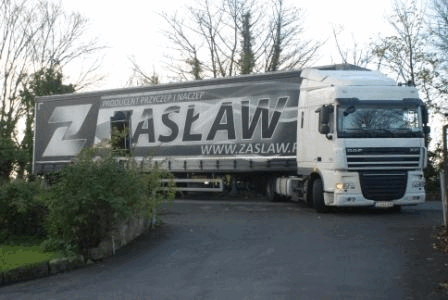 A gif consisting of a large HGV truck delivering an alcohol still