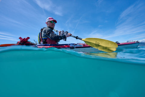 Kayaking split level, half over half underwater photo by dan m lee in Alaska