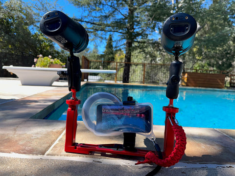 waterproof phone case tripod mounted to a bracket and underwater lights for submerged photography