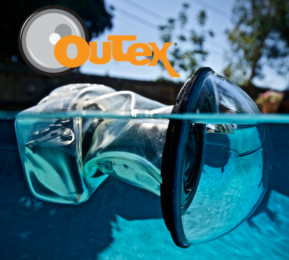 Outex underwater housing system for cameras and optical glass dome port floating in a pool