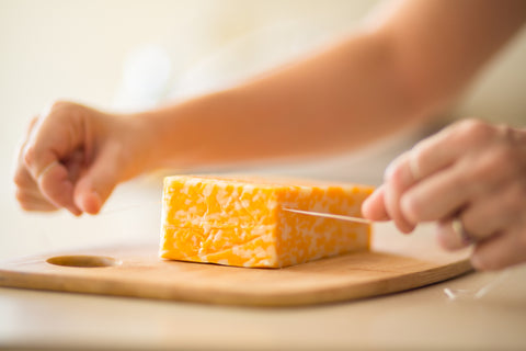 Dental floss cutting cheese