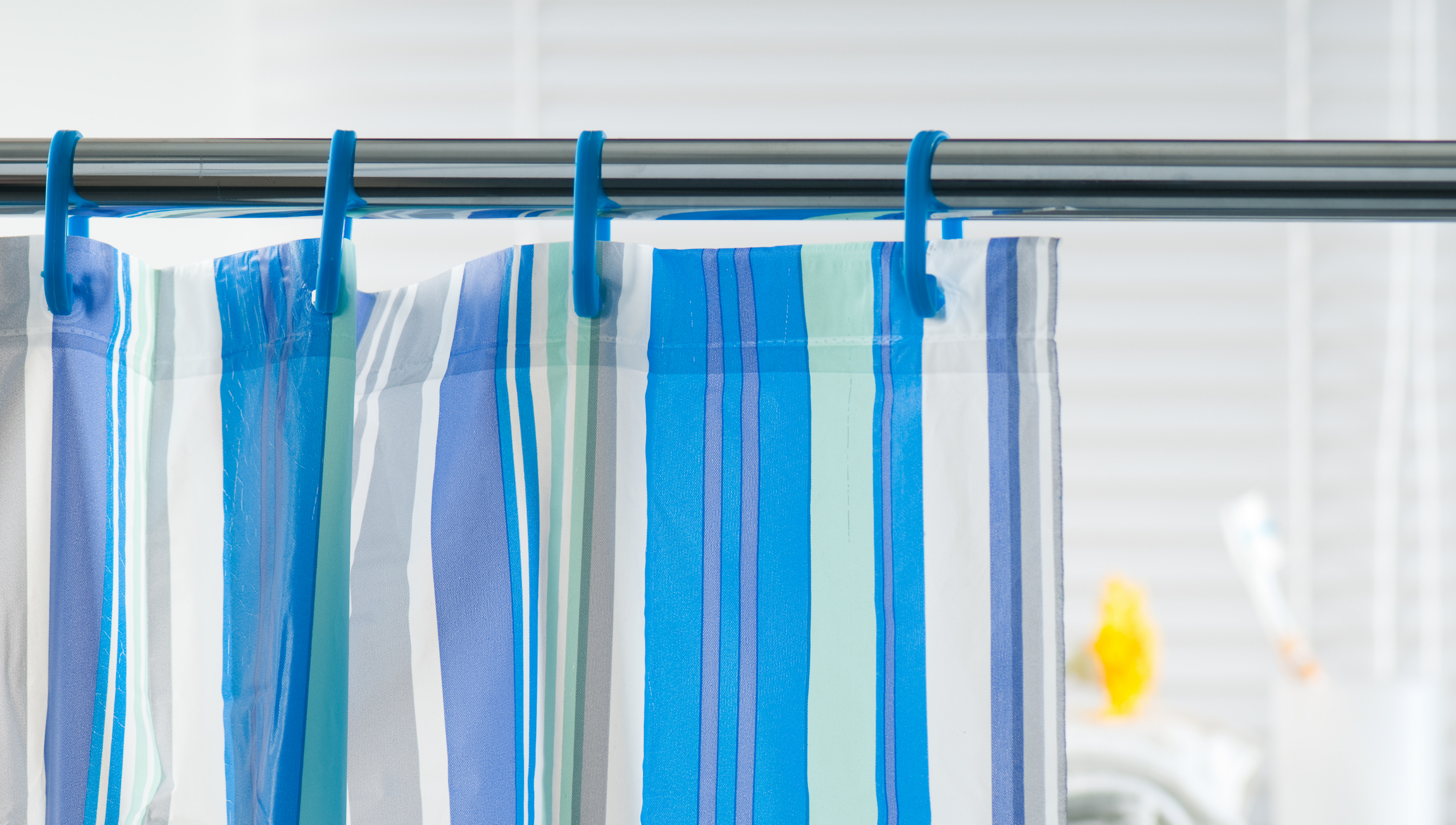 spring cleaning the shower curtain