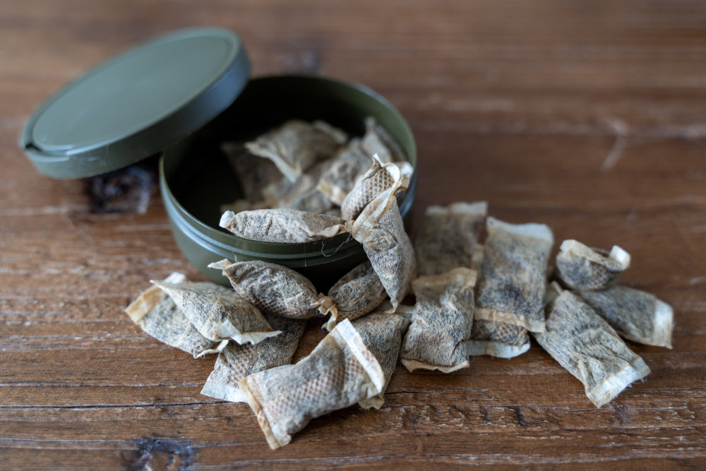 An open tub of snus pouches