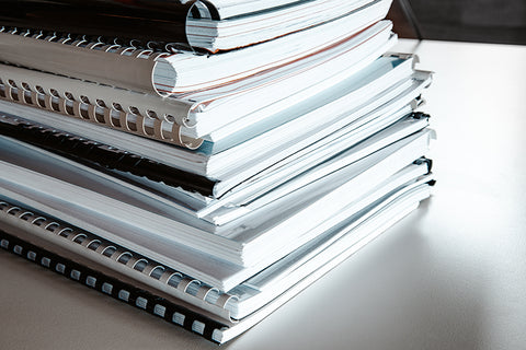 Stack of notebooks on table
