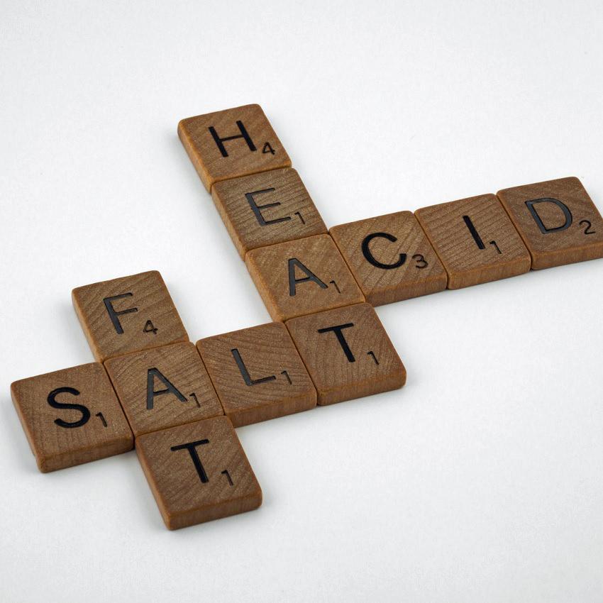 Scrabble tiles spell out Fat, Salt, Heat and Acid. One reason you're awake is consumption of foods that trigger indigestion.