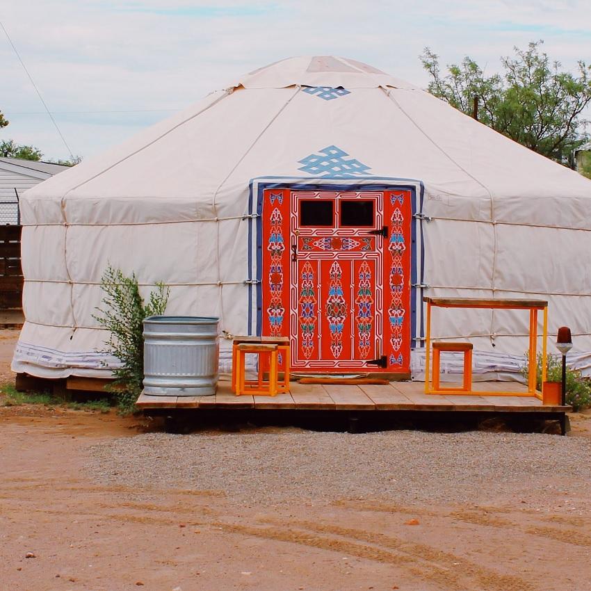 A cozy glamping tent with a unique entry. Spaciousness, seclusion, and creature comforts allow you to sleep more comfortably.