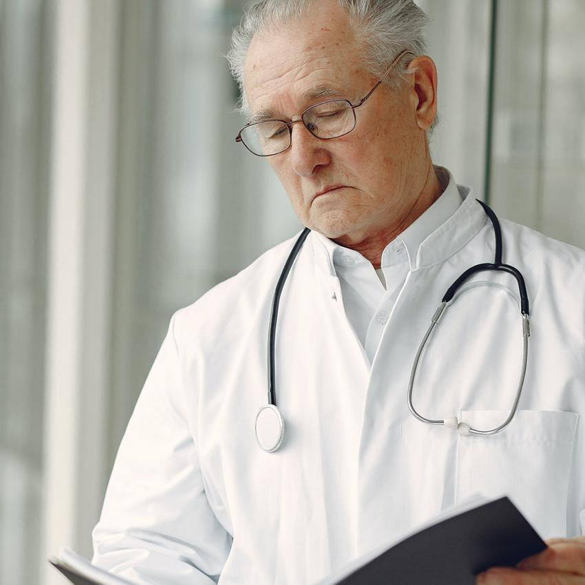 Doctor looking at health chart
