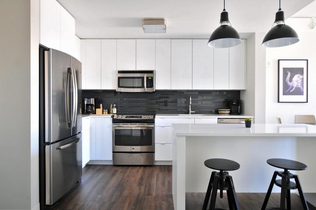A modern black & white themed kitchen with modern appliances