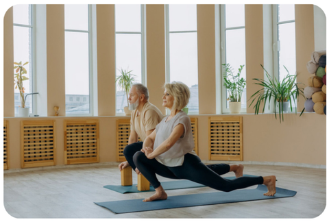 Man Woman couple doing yoga stretches