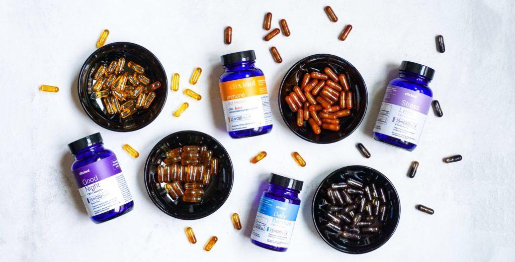 bottles and bowls of vitamins and supplements 