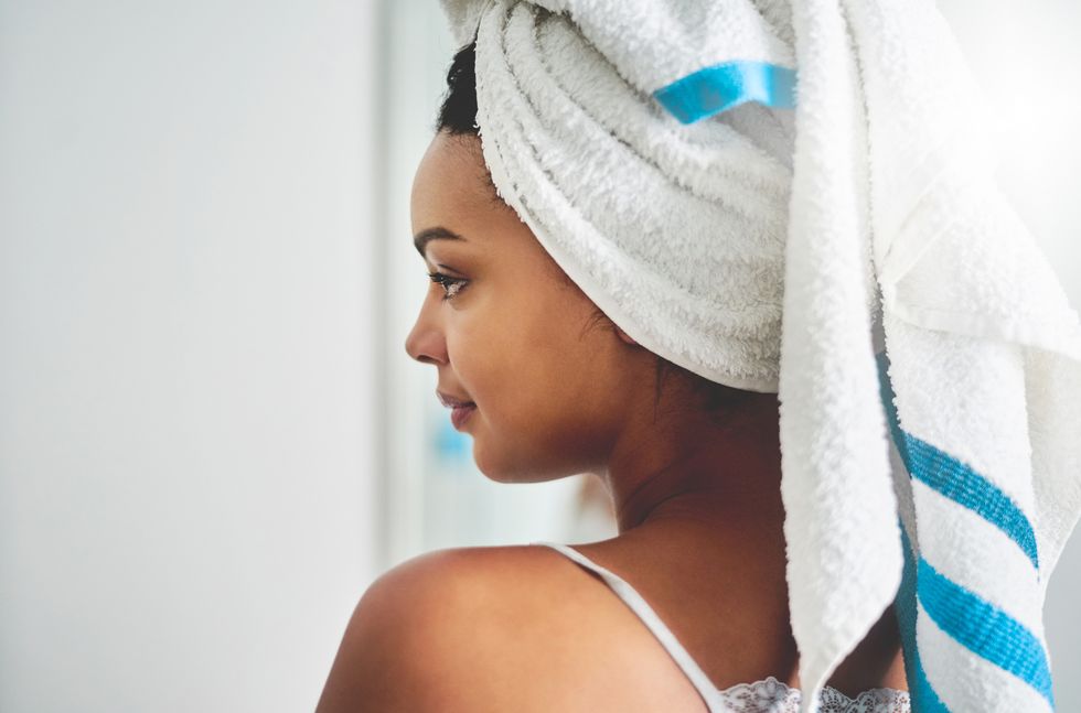 woman with white and blue towel wrapper around head