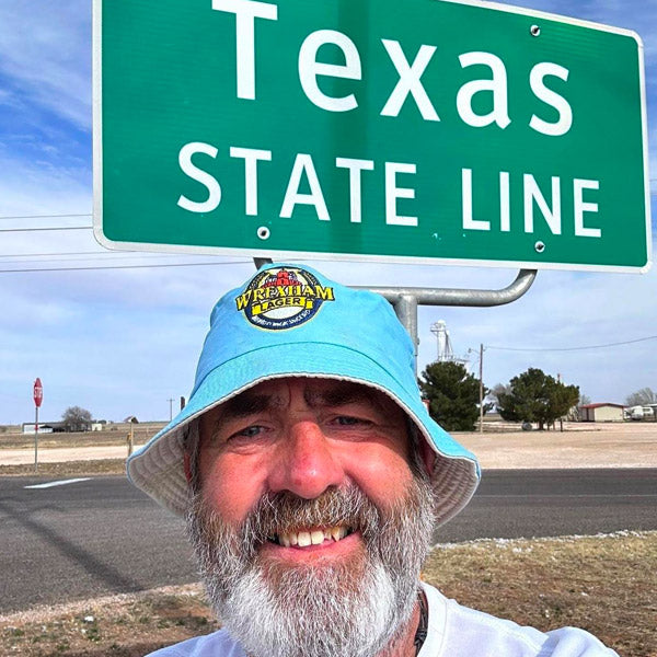 Man at Texas State Line with Wrexham Lager