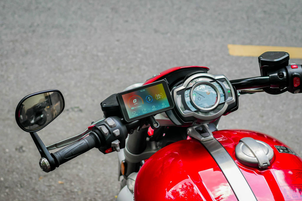 The AIO-5 Lite installed on the left side of the motorcycle dashboard