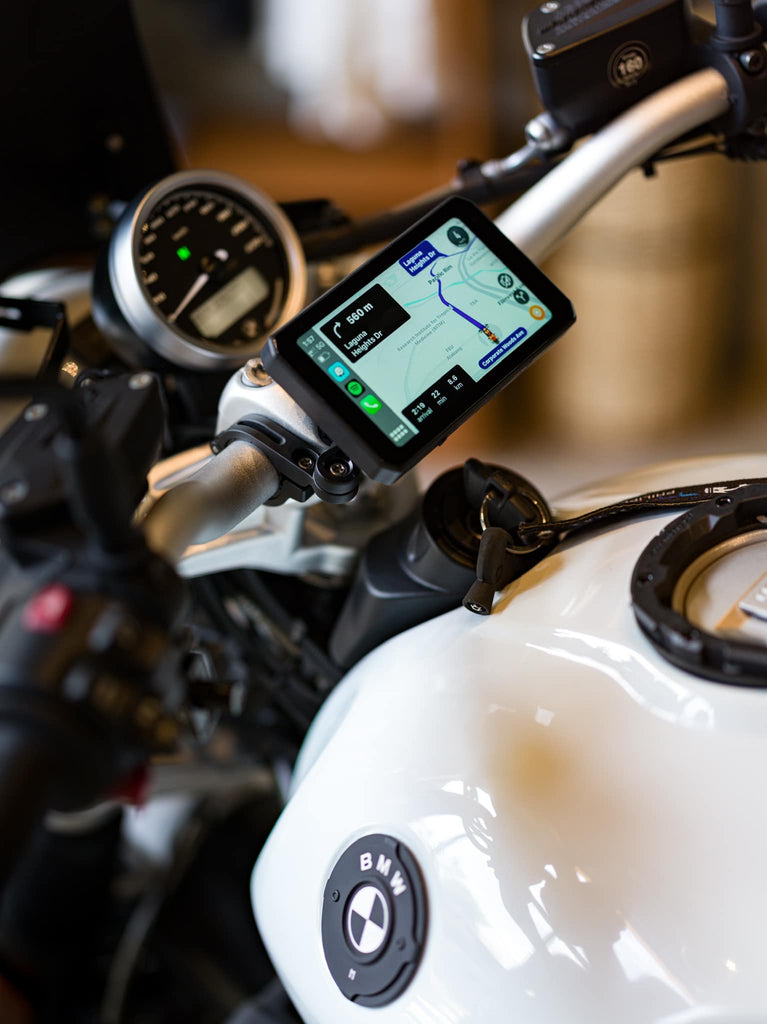 The AIO-5 Lite installed in the center of the motorcycle dashboard