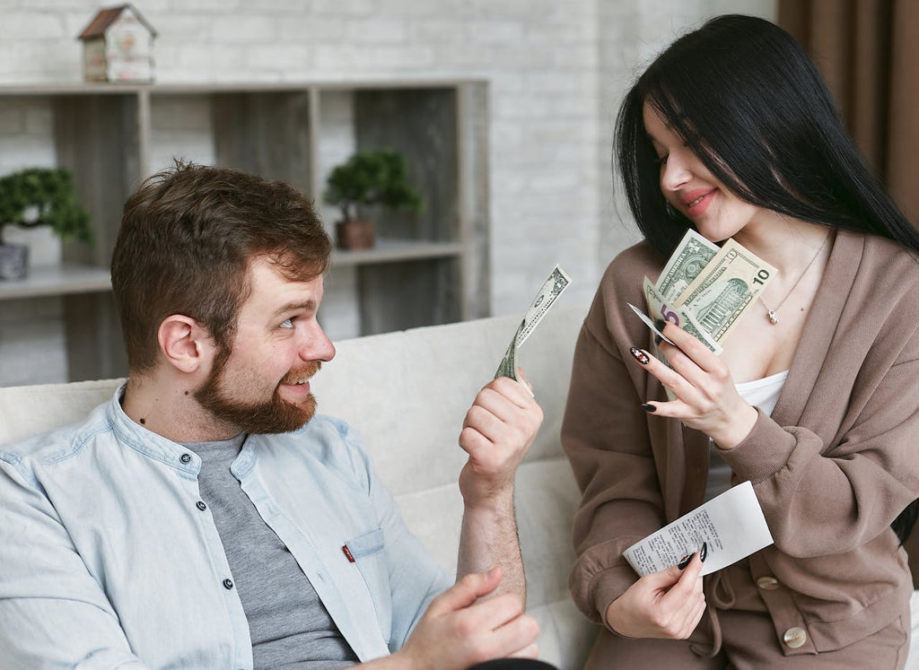 Girl holds partner's money