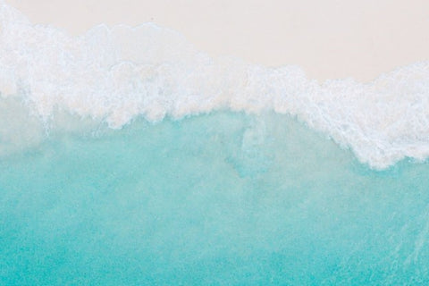 crystal clear aqua blue sea water on a white sandy beach