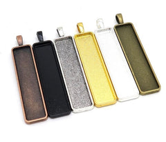 https://www.perfectpendantsplus.com/collections/square-rectangle-bezel-pendant-blanks/products/copy-of-10mmx50mm-long-vertical-rectangles-bezels-for-earrings-top-loop