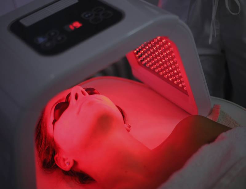 led light therapy on woman