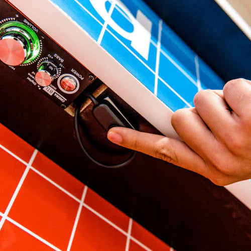Press the button under the control panel and wait for the system to boot