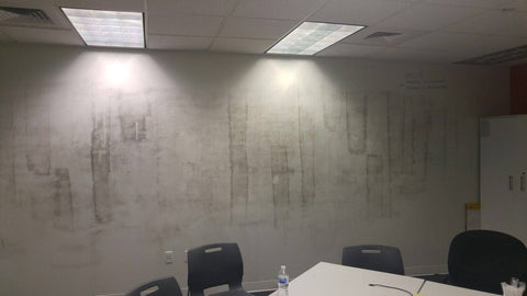 Whiteboard paint on a wall showing roller texture