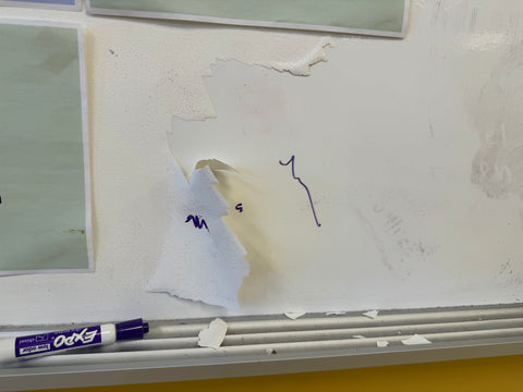 Whiteboard paint peeling from a smooth surface