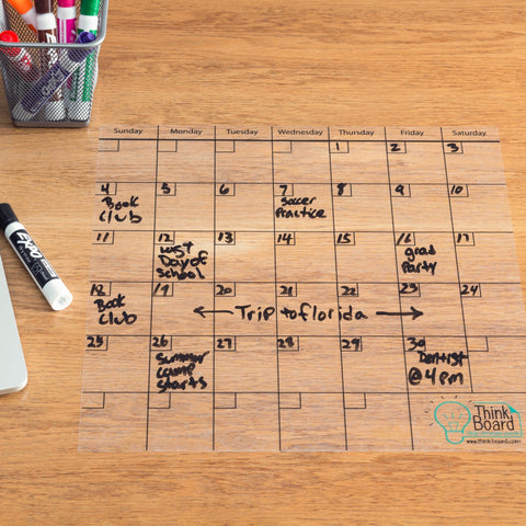 a Think Board Calendar being used on a table