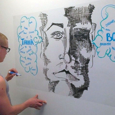 someone drawing art on a Think Board white board