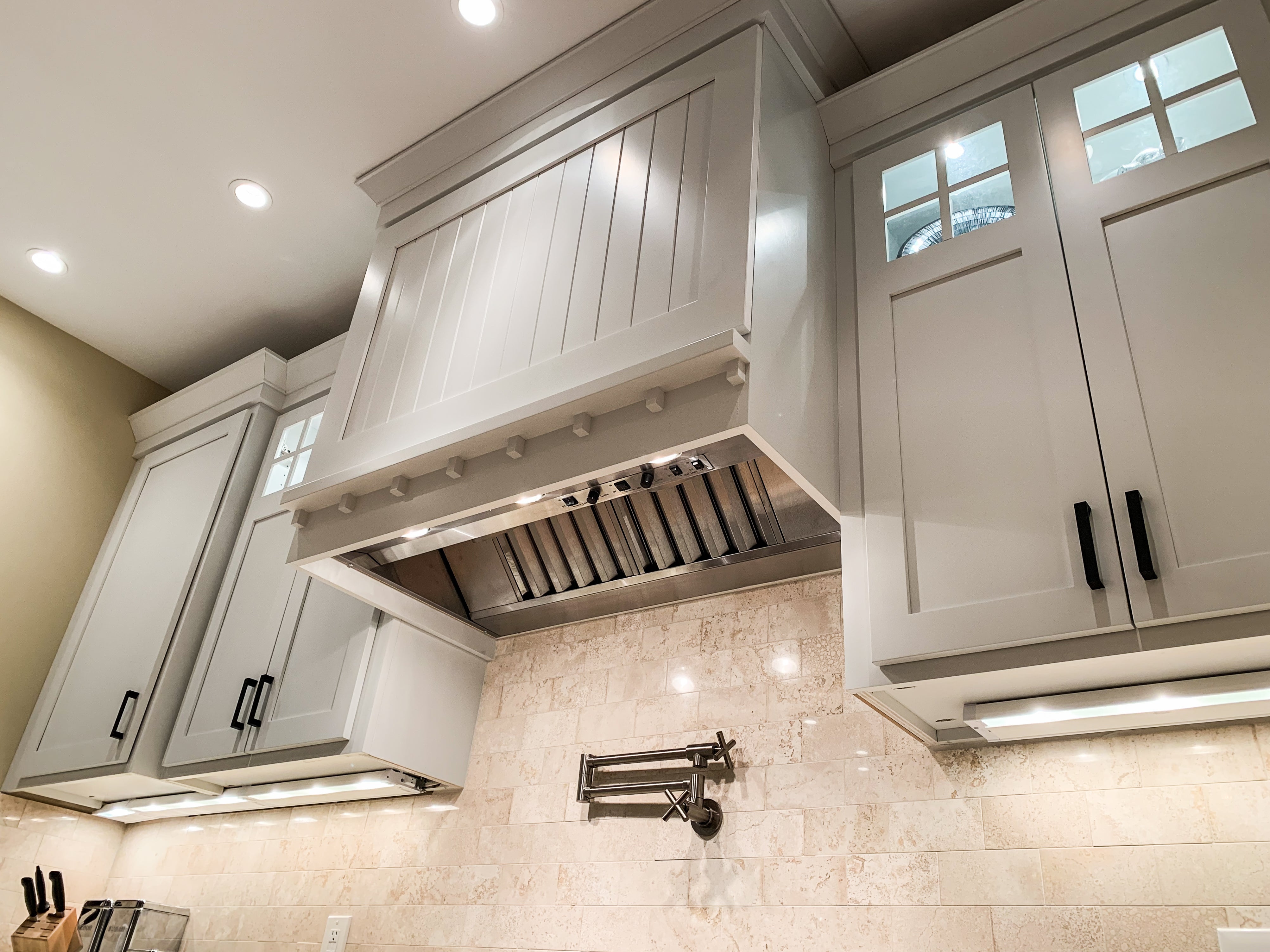 Beige Cabinetry with Custom Hood