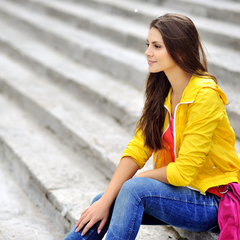 Model wearing yellow jacket with jeans