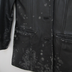 Black leather jacket with mould spots